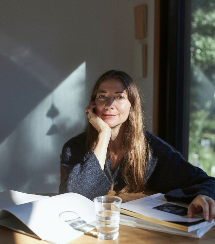 anja at a table in the afternoon light