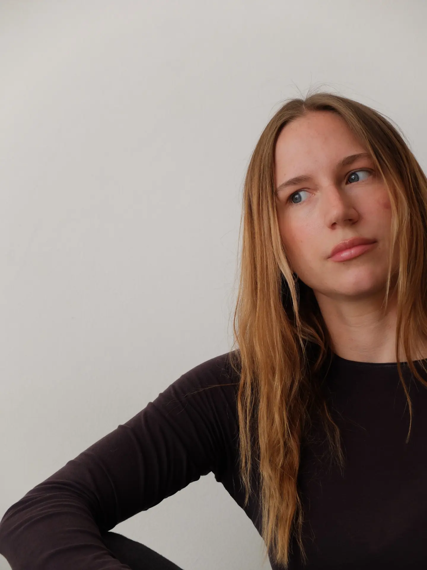 Anja Wittmann looking to the side in a calm, natural light portrait
